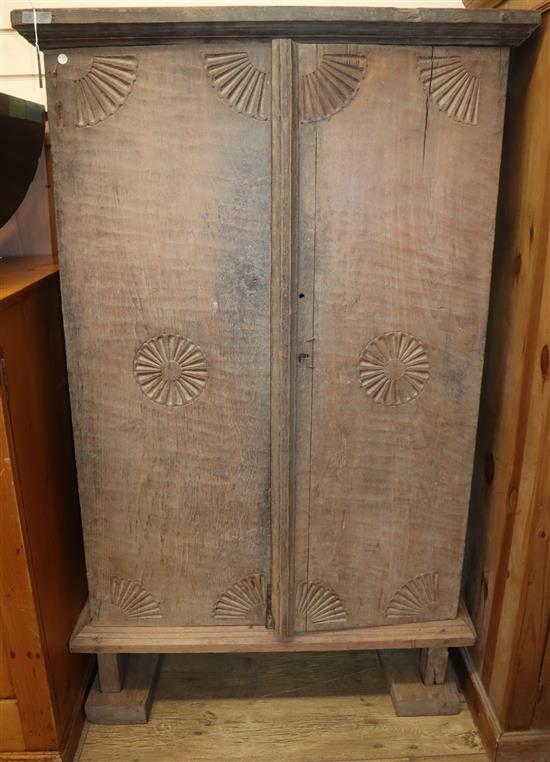 A Javanese solid teak cupboard W.95cm